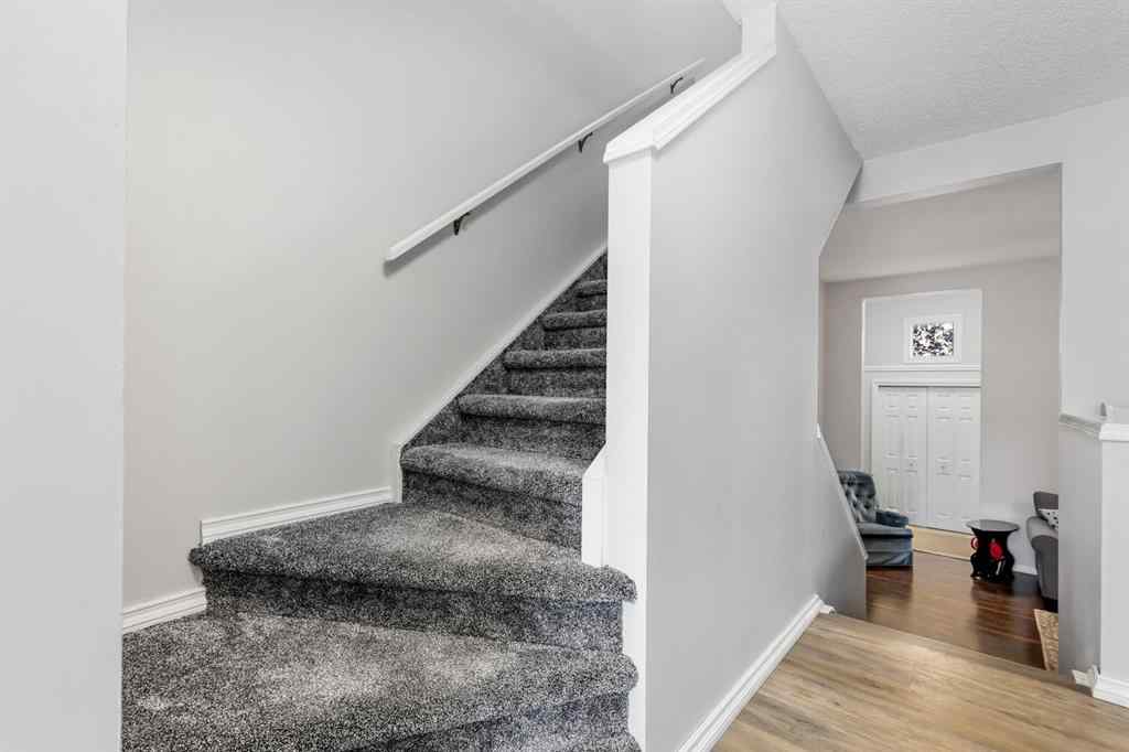 MLS® A2263273 - Unit #8 7 Westland Road  in Westridge Okotoks, Residential