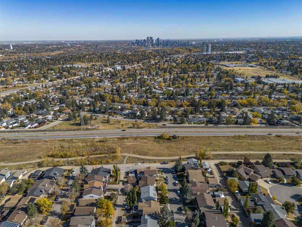 MLS® A2263280 - 72 Strathcona Crescent  in Strathcona Park Calgary, Residential