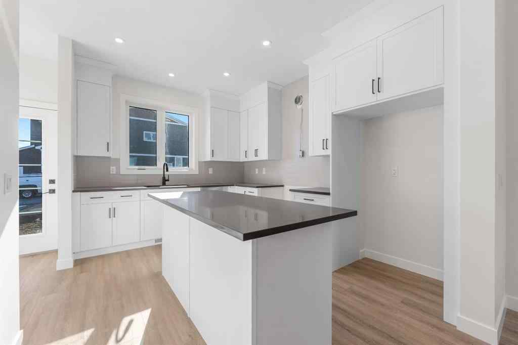 MLS® A2263349 - 97 Ambleton Boulevard NW in Moraine Calgary, Residential