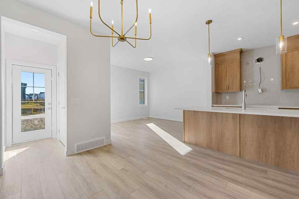 MLS® A2263359 - 125 Ambleton Boulevard NW in Moraine Calgary, Residential