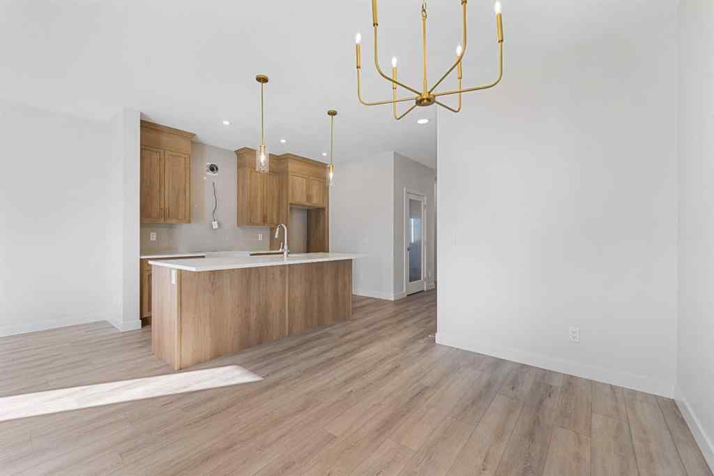 MLS® A2263359 - 125 Ambleton Boulevard NW in Moraine Calgary, Residential