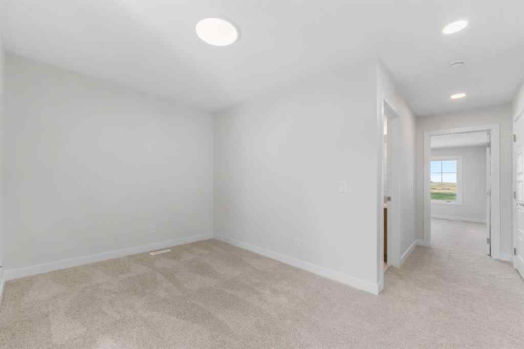 MLS® A2263359 - 125 Ambleton Boulevard NW in Moraine Calgary, Residential