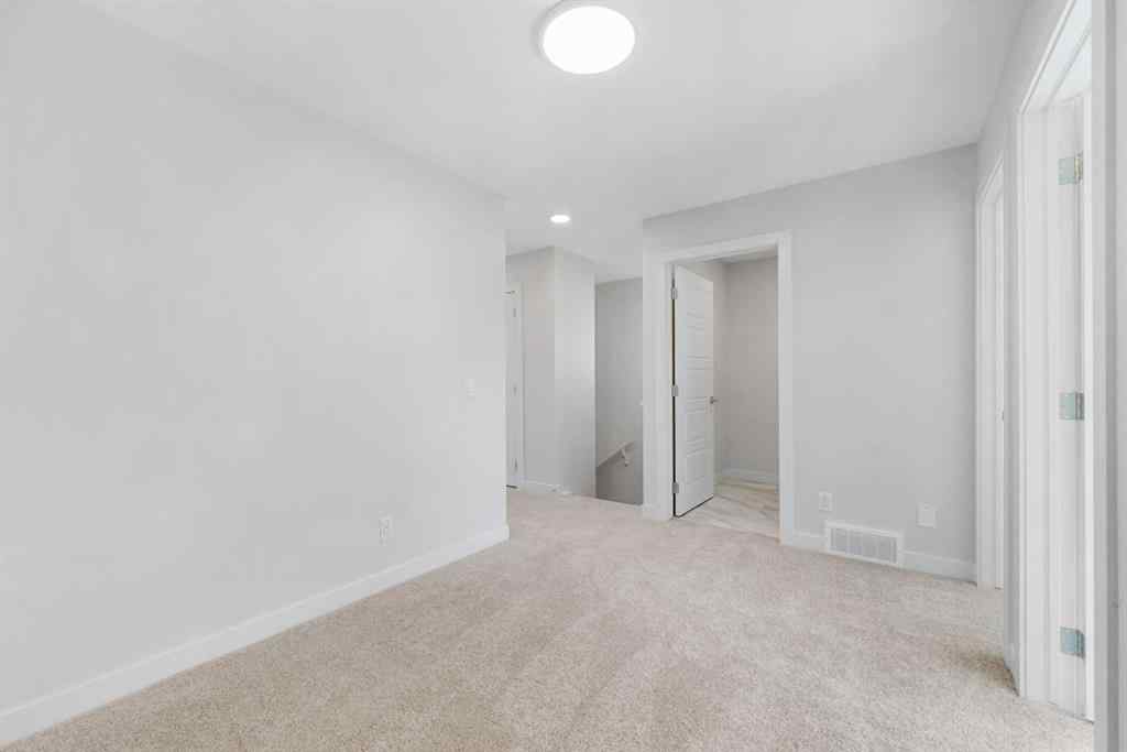 MLS® A2263359 - 125 Ambleton Boulevard NW in Moraine Calgary, Residential