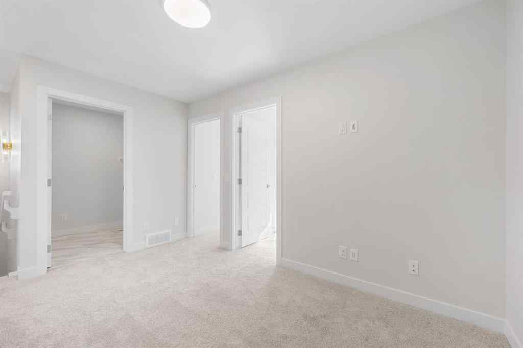 MLS® A2263359 - 125 Ambleton Boulevard NW in Moraine Calgary, Residential