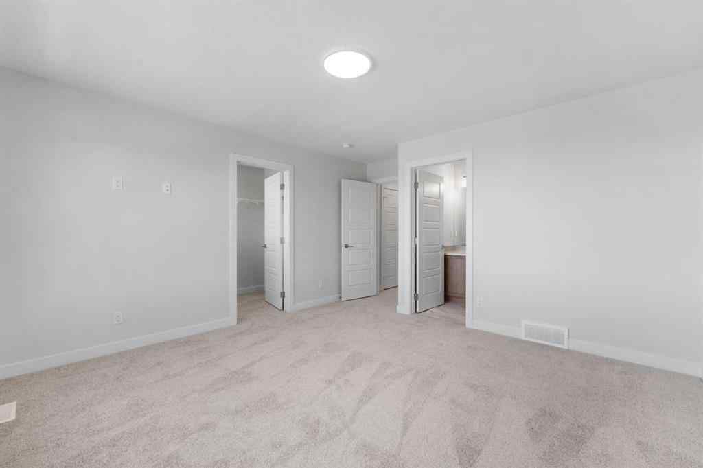 MLS® A2263359 - 125 Ambleton Boulevard NW in Moraine Calgary, Residential