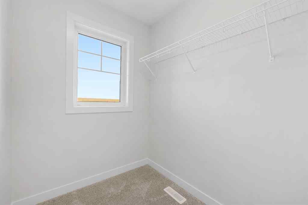 MLS® A2263359 - 125 Ambleton Boulevard NW in Moraine Calgary, Residential