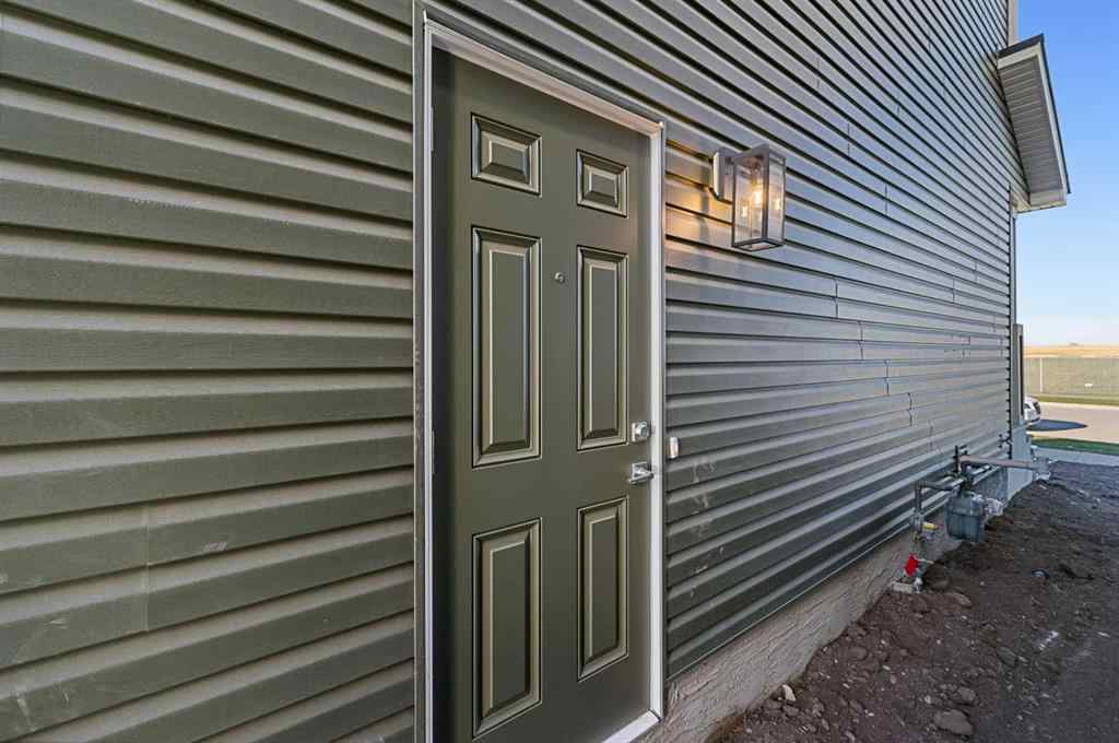 MLS® A2263359 - 125 Ambleton Boulevard NW in Moraine Calgary, Residential