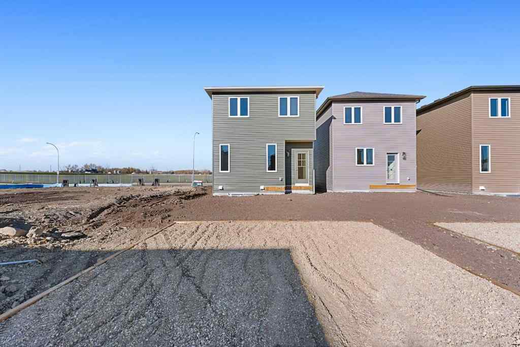 MLS® A2263359 - 125 Ambleton Boulevard NW in Moraine Calgary, Residential