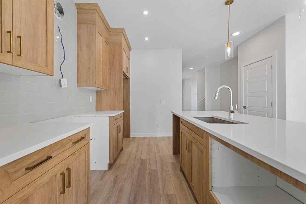 MLS® A2263359 - 125 Ambleton Boulevard NW in Moraine Calgary, Residential