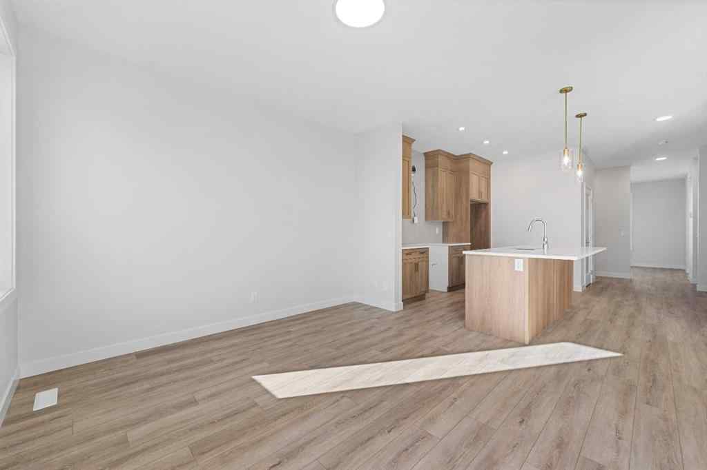 MLS® A2263359 - 125 Ambleton Boulevard NW in Moraine Calgary, Residential