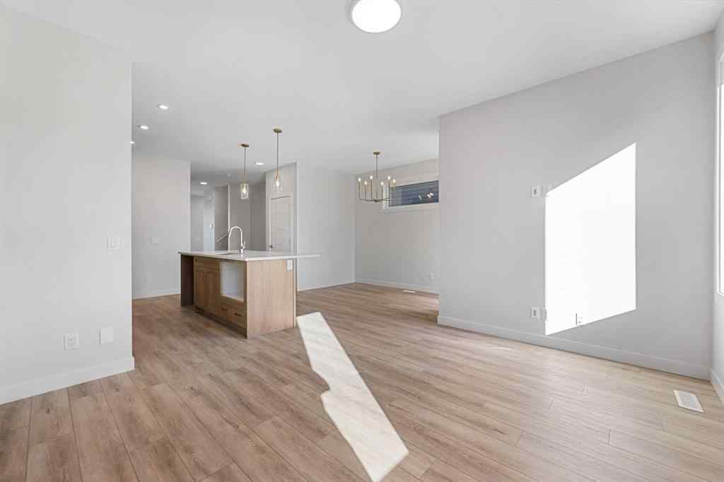 MLS® A2263359 - 125 Ambleton Boulevard NW in Moraine Calgary, Residential