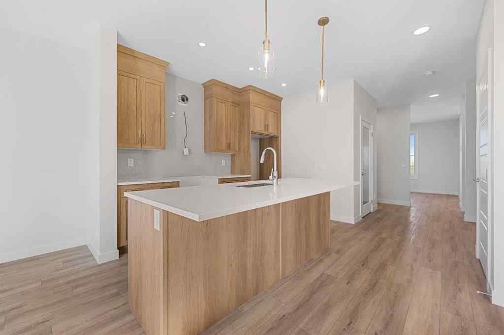 MLS® A2263359 - 125 Ambleton Boulevard NW in Moraine Calgary, Residential