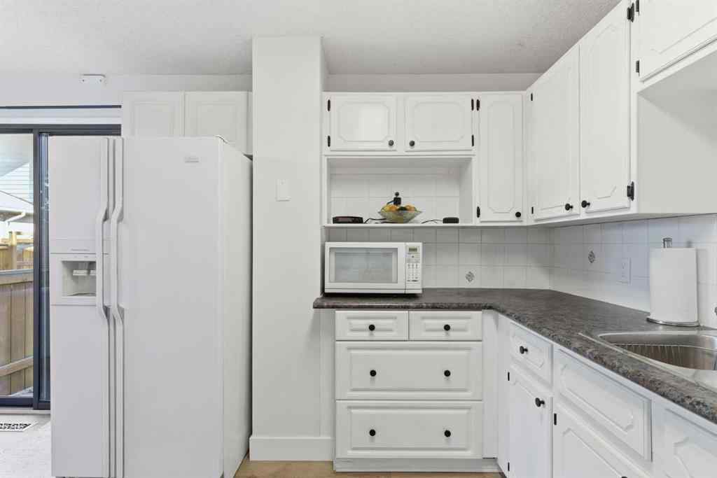 MLS® A2263400 - 91 Deerfield Drive SE in Deer Ridge Calgary, Residential