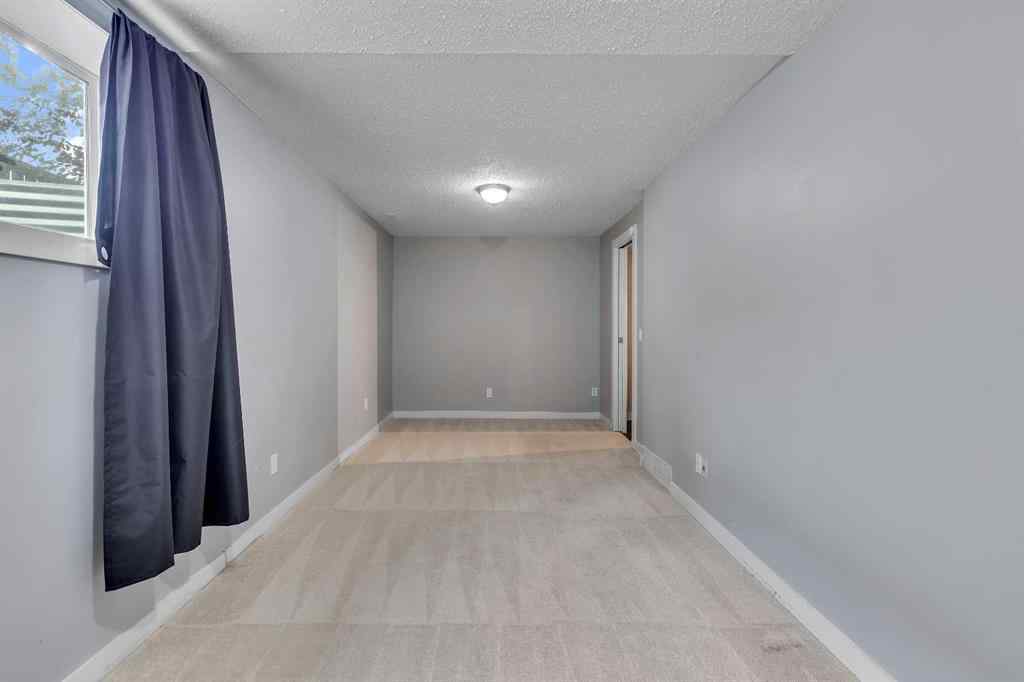 MLS® A2263459 - 164 Deerview Way SE in Deer Ridge Calgary, Residential