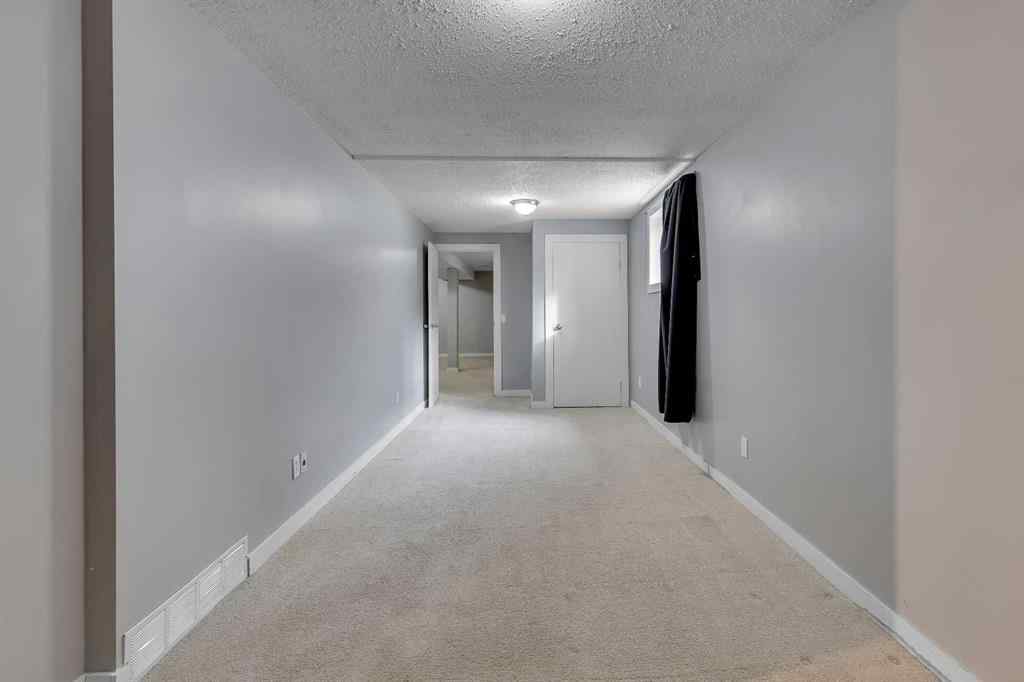 MLS® A2263459 - 164 Deerview Way SE in Deer Ridge Calgary, Residential