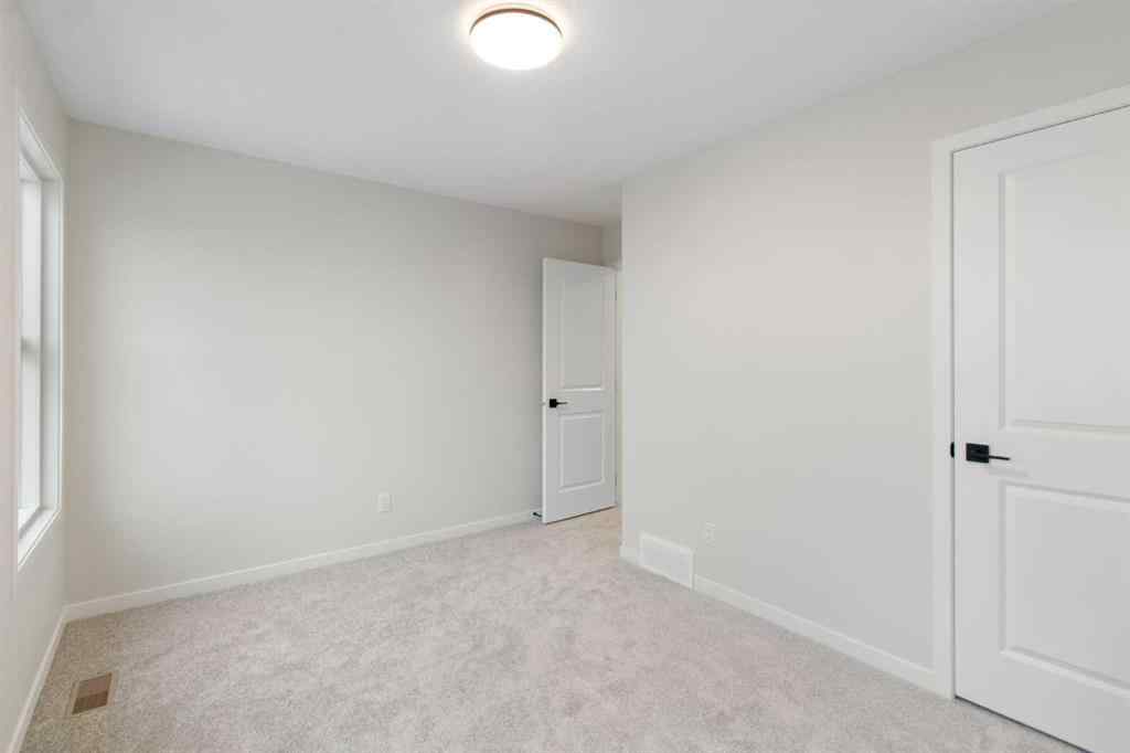 MLS® A2263502 - 164 Belmont Place SW in Belmont Calgary, Residential