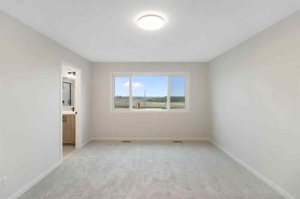 MLS® A2263502 - 164 Belmont Place SW in Belmont Calgary, Residential