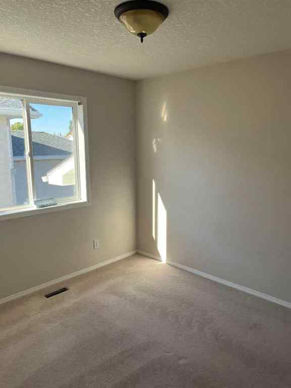 MLS® A2263537 - 64 Ermineview Way N in Uplands Lethbridge, Residential