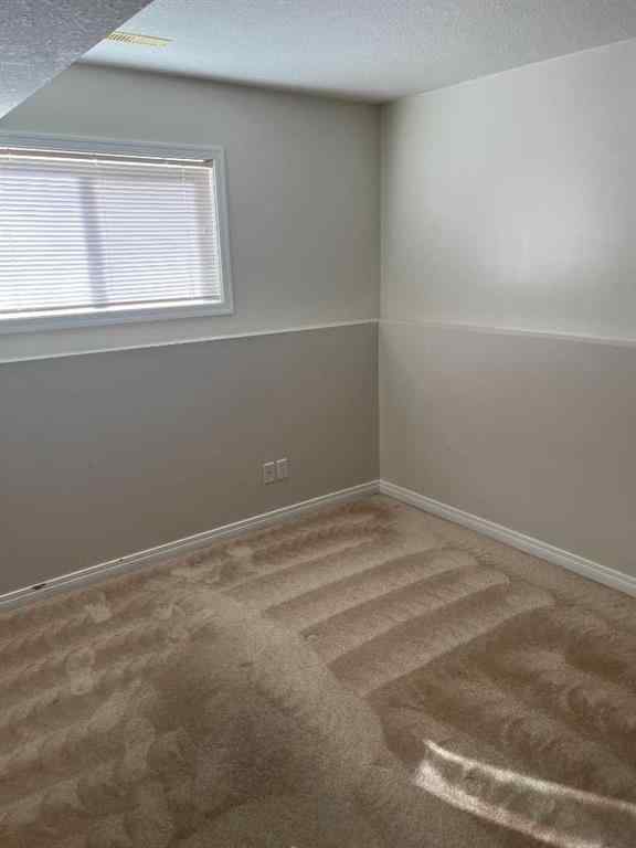 MLS® A2263537 - 64 Ermineview Way N in Uplands Lethbridge, Residential