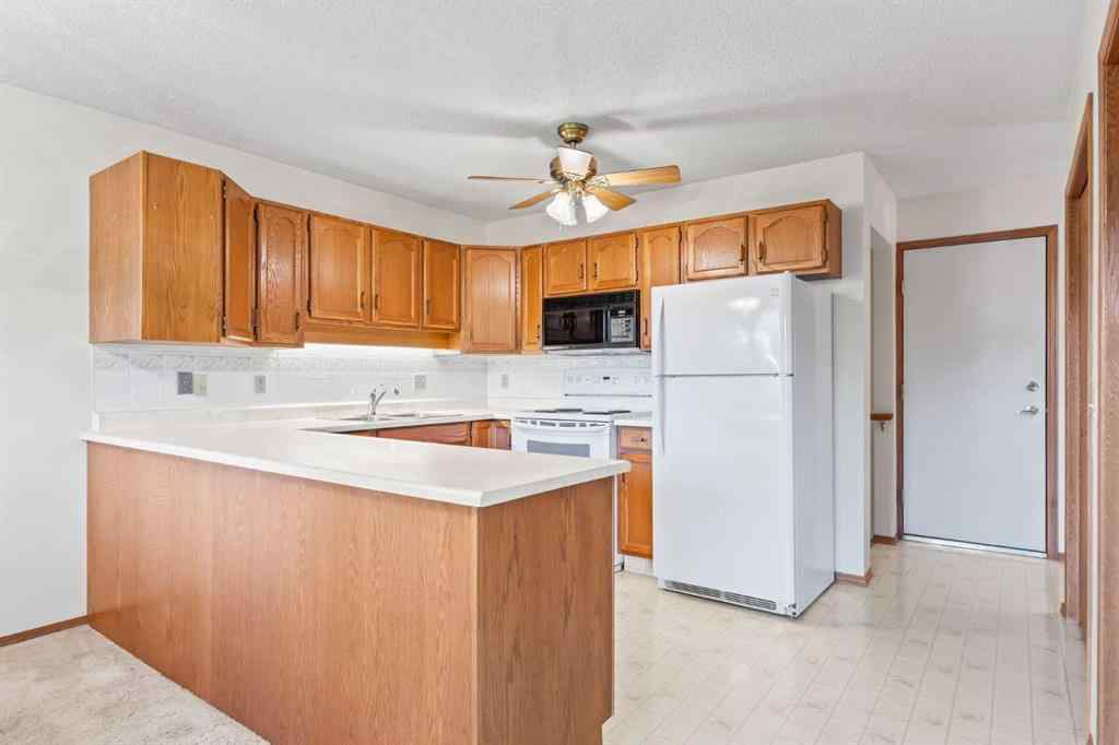 MLS® A2263600 - 52 Sandarac Circle NW in Sandstone Valley Calgary, Residential