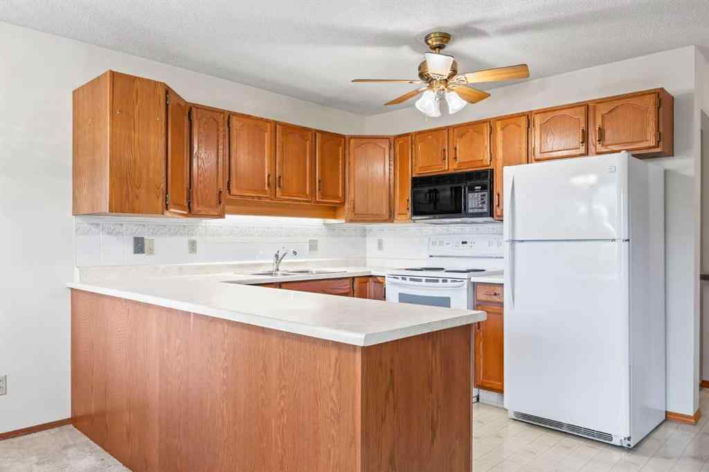 MLS® A2263600 - 52 Sandarac Circle NW in Sandstone Valley Calgary, Residential