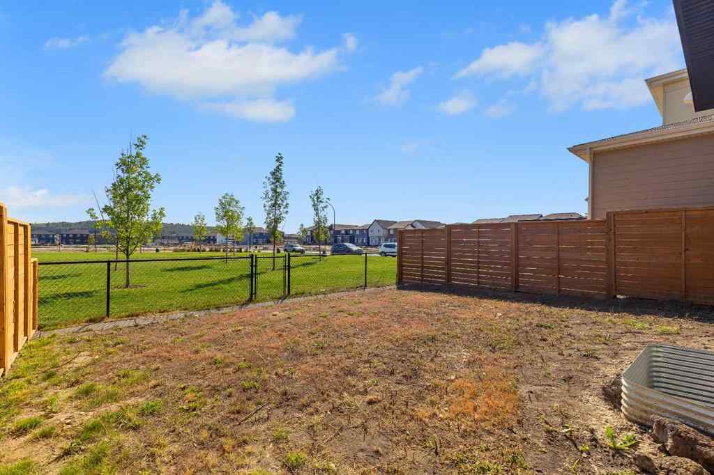 MLS® A2263620 - 211 Creekstone Row SW in Pine Creek Calgary, Residential