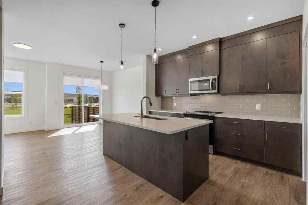 MLS® A2263620 - 211 Creekstone Row SW in Pine Creek Calgary, Residential