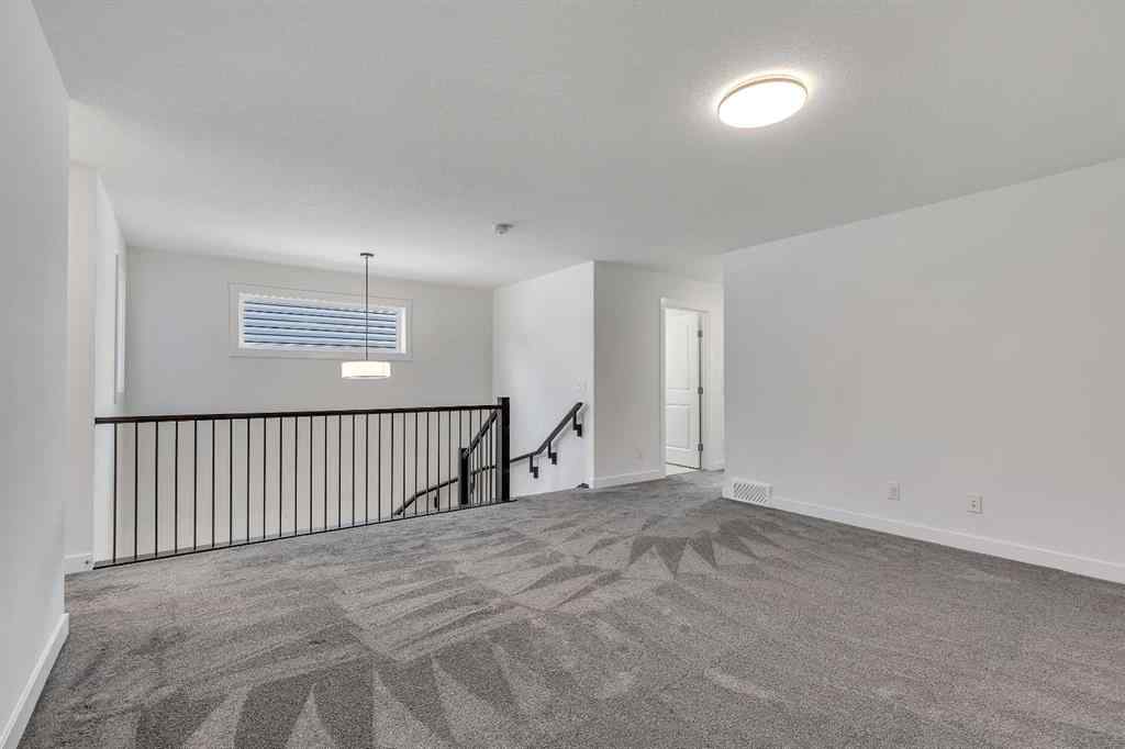 MLS® A2263620 - 211 Creekstone Row SW in Pine Creek Calgary, Residential