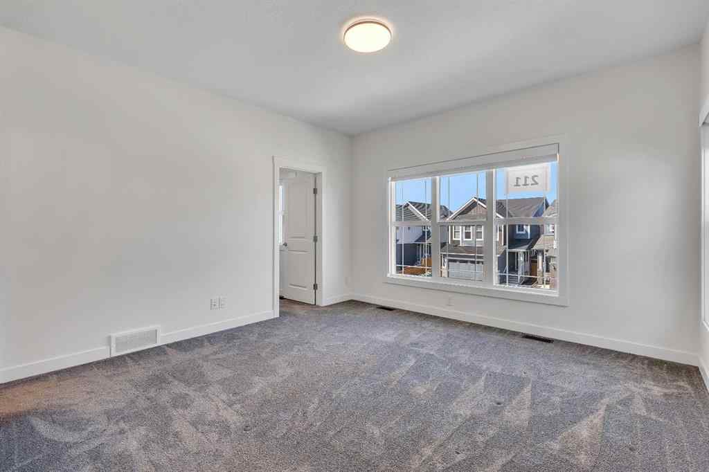 MLS® A2263620 - 211 Creekstone Row SW in Pine Creek Calgary, Residential