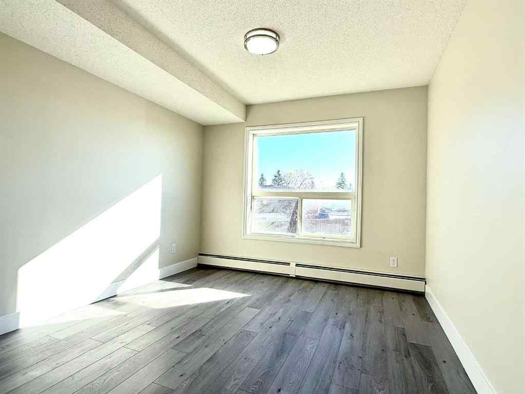 MLS® A2263672 - Unit #207 5555 Falsbridge Drive NE in Falconridge Calgary, Residential