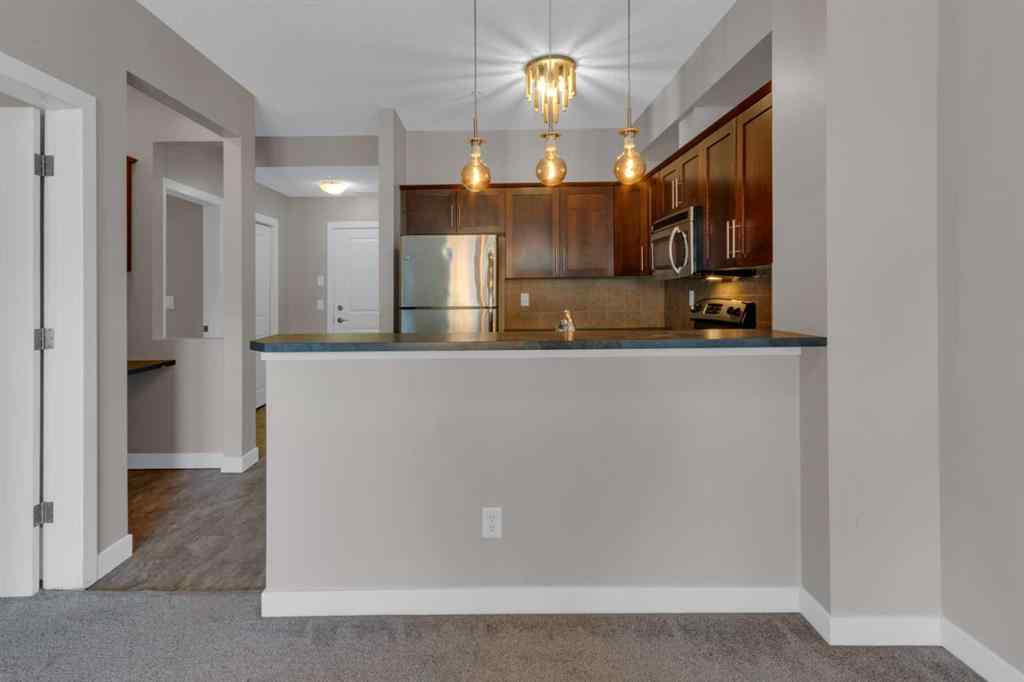 MLS® A2263682 - Unit #111 205 Sunset Drive  in Sunset Ridge Cochrane, Residential