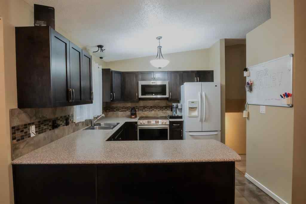 MLS® A2263707 - 9048 104 Avenue  in Crystal Heights Grande Prairie, Residential