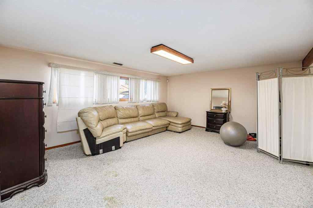 MLS® A2263775 - 32 Huget Crescent  in Highland Green Red Deer, Residential