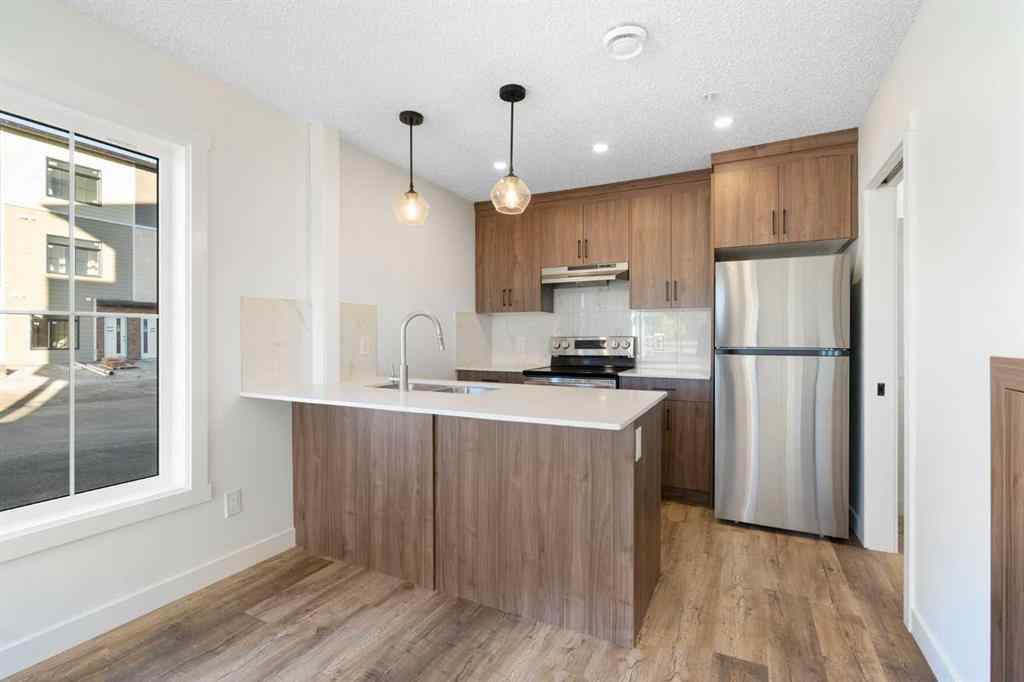 MLS® A2263817 - Unit #101 156 Park Street  in Greystone Cochrane, Residential
