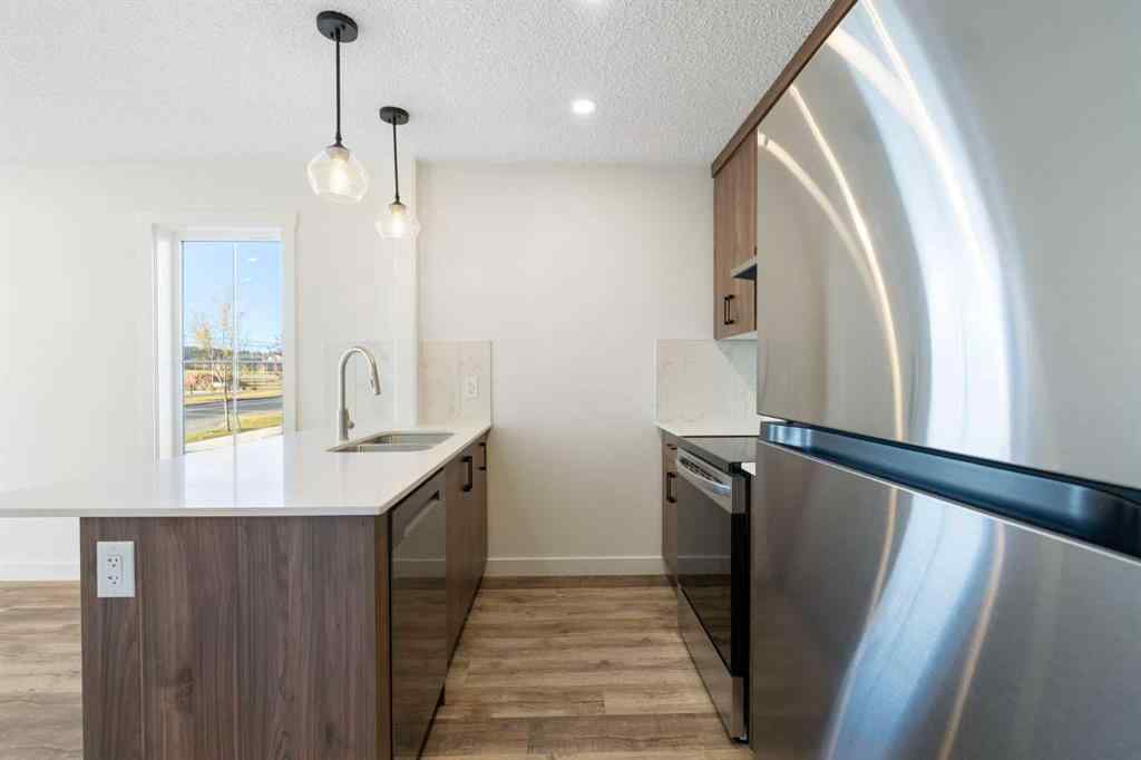 MLS® A2263817 - Unit #101 156 Park Street  in Greystone Cochrane, Residential