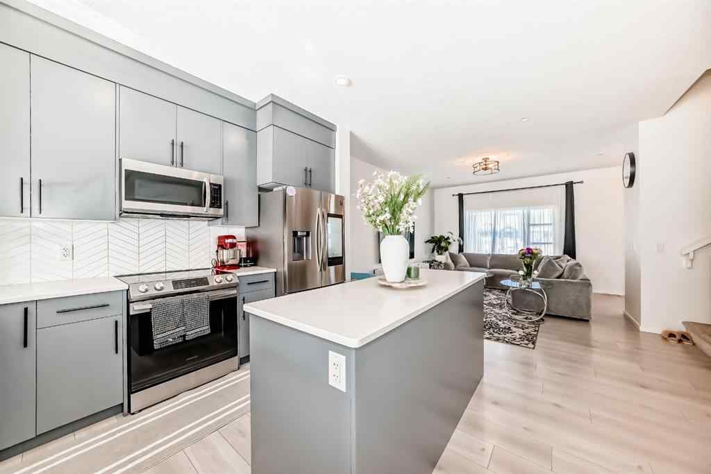 MLS® A2263924 - 215 148 Avenue NW in Livingston Calgary, Residential