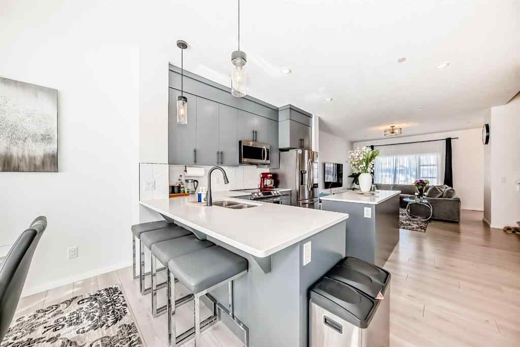 MLS® A2263924 - 215 148 Avenue NW in Livingston Calgary, Residential