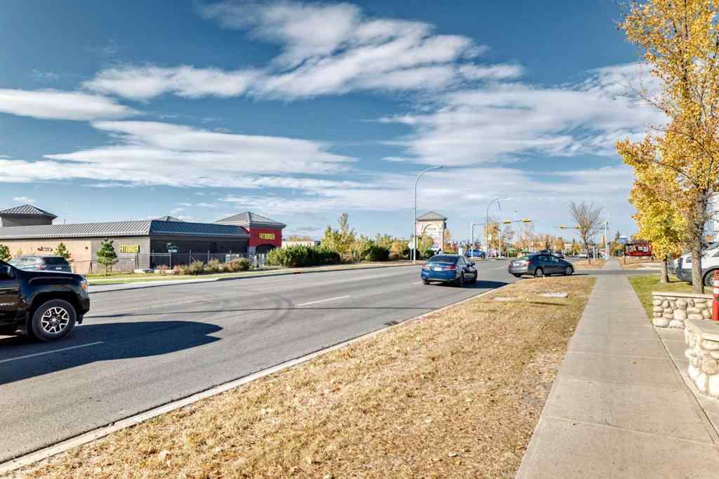 MLS&reg; # A2263997 - Unit #8201 403 Mackenzie Way SW in Downtown Airdrie, Residential Open Houses