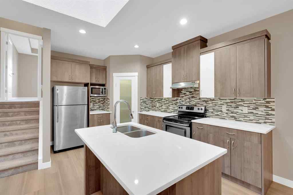 MLS® A2264015 - 87 Baysprings Way SW in Baysprings Airdrie, Residential