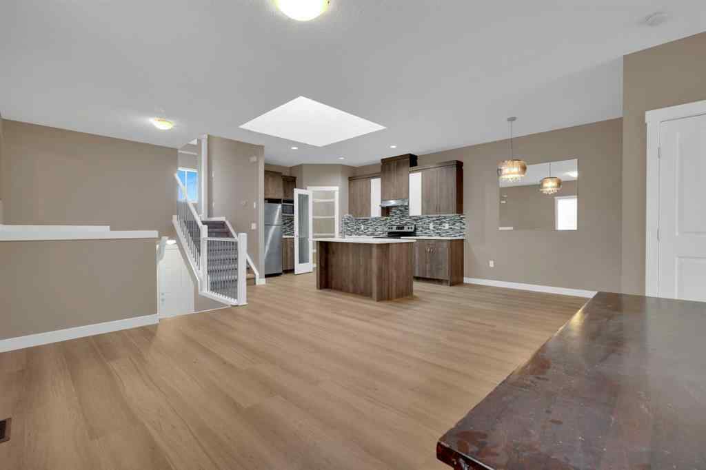 MLS® A2264015 - 87 Baysprings Way SW in Baysprings Airdrie, Residential