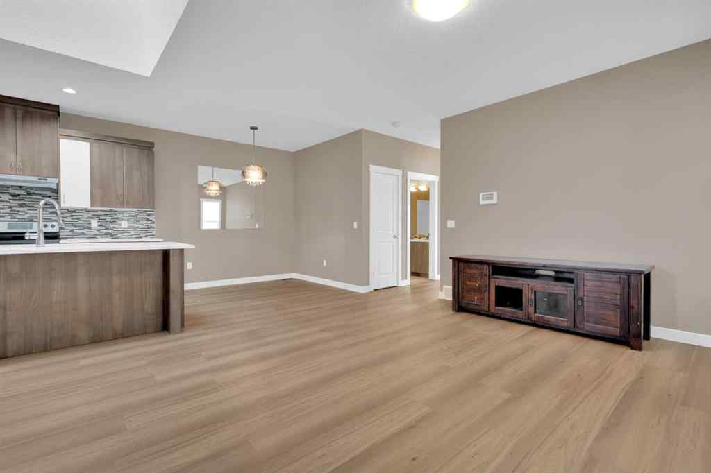 MLS® A2264015 - 87 Baysprings Way SW in Baysprings Airdrie, Residential