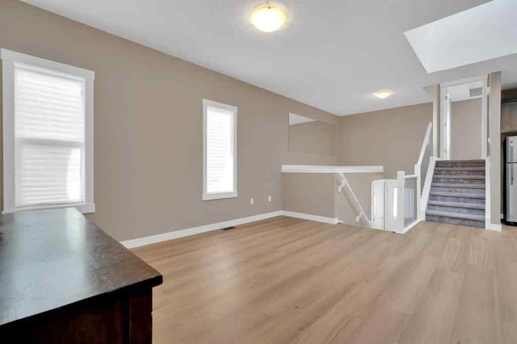 MLS® A2264015 - 87 Baysprings Way SW in Baysprings Airdrie, Residential