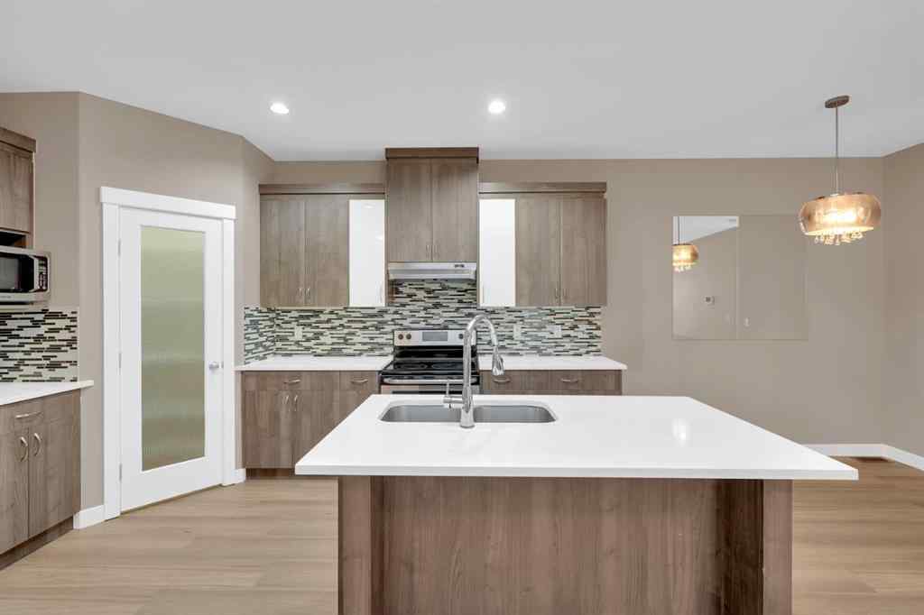 MLS® A2264015 - 87 Baysprings Way SW in Baysprings Airdrie, Residential