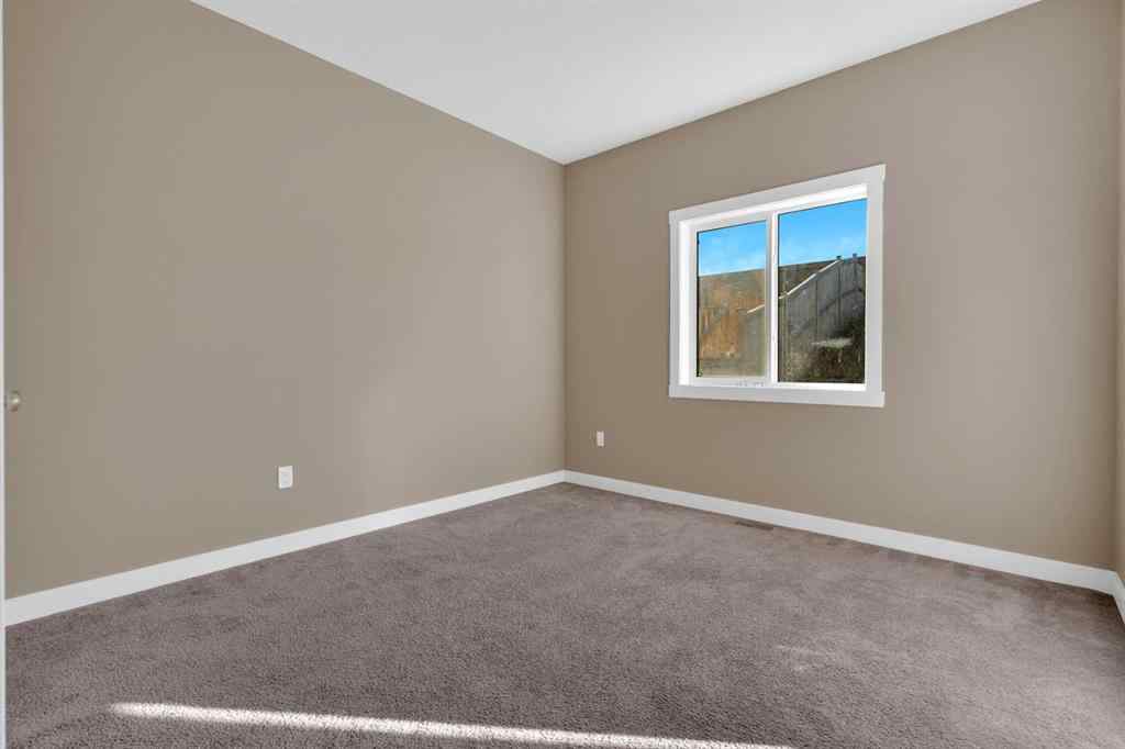 MLS® A2264015 - 87 Baysprings Way SW in Baysprings Airdrie, Residential