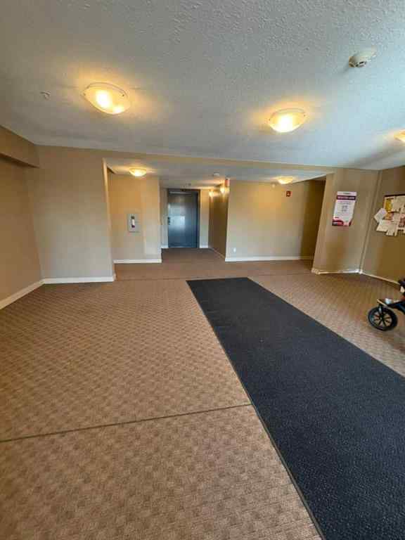 MLS® A2264022 - Unit #218 5 Saddlestone Way NE in Saddle Ridge Calgary, Residential