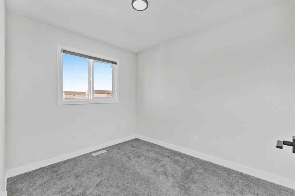 MLS® A2264027 - 33 BELMONT Drive SW in Belmont Calgary, Residential