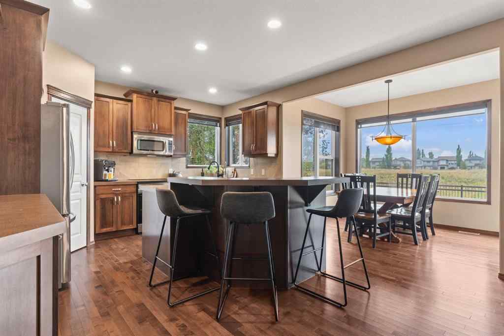 MLS® A2264040 - 498 Tuscany Ravine Road NW in Tuscany Calgary, Residential