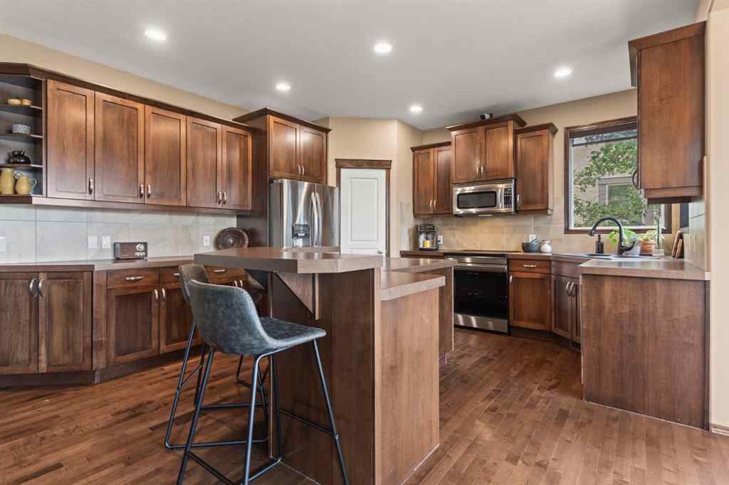 MLS® A2264040 - 498 Tuscany Ravine Road NW in Tuscany Calgary, Residential