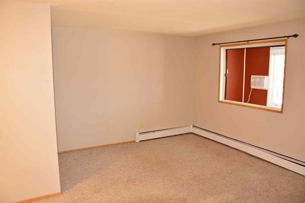 MLS® A2264118 - Unit #101-215 10118 100 Avenue  in Downtown Peace River, Multi-Family