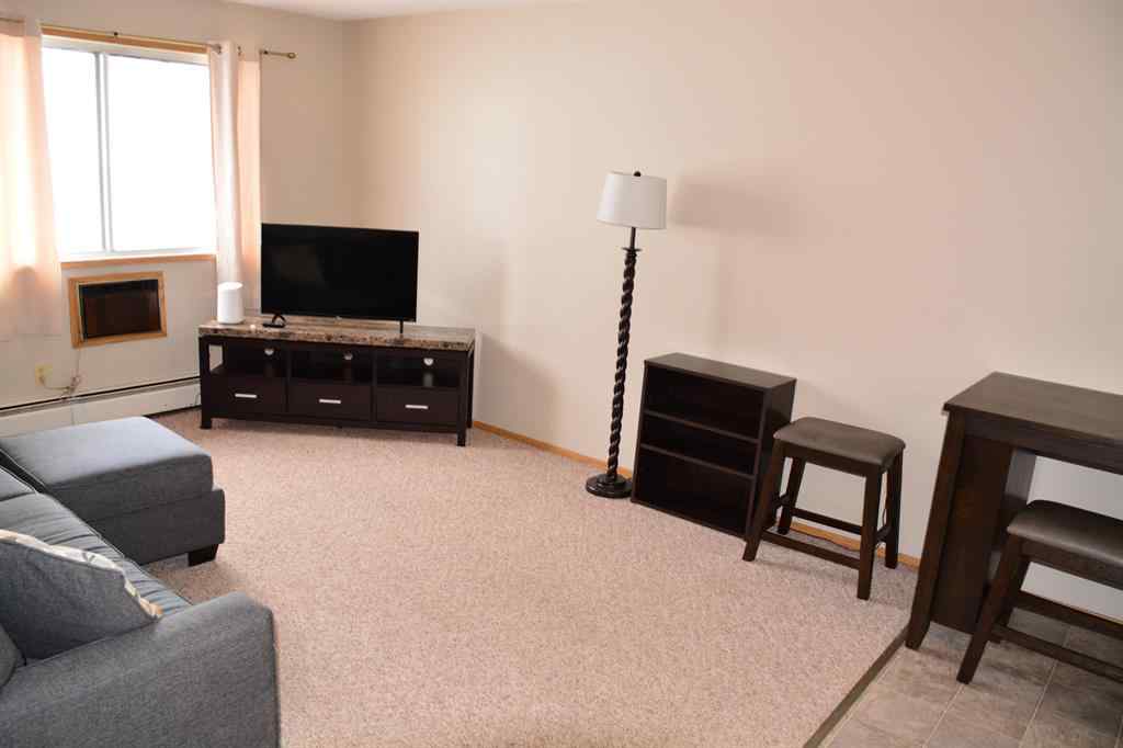 MLS® A2264118 - Unit #101-215 10118 100 Avenue  in Downtown Peace River, Multi-Family